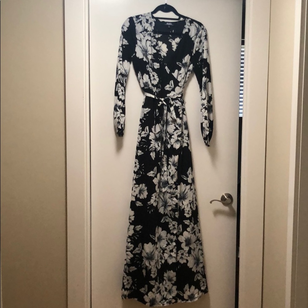 Long sleeve, floor length dress.
